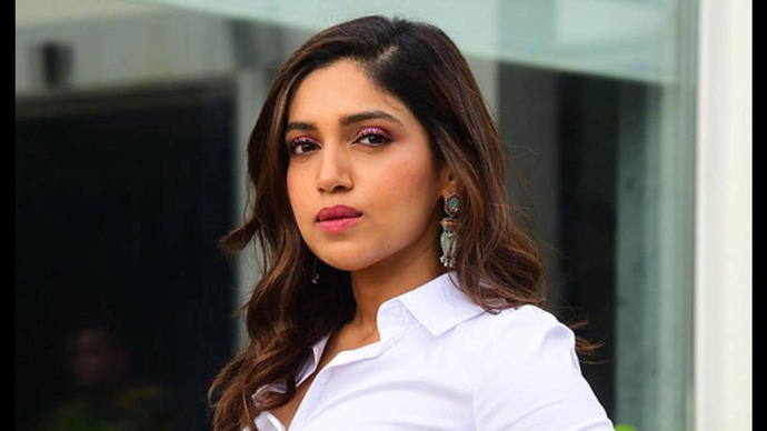 Bhumi Pednekar smiling brightly at an event, showcasing a warm and engaging expression.