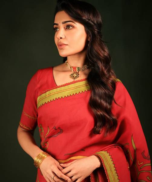 Samantha Ruth Prabhu poses elegantly in a shimmering silver outfit with dramatic styling.