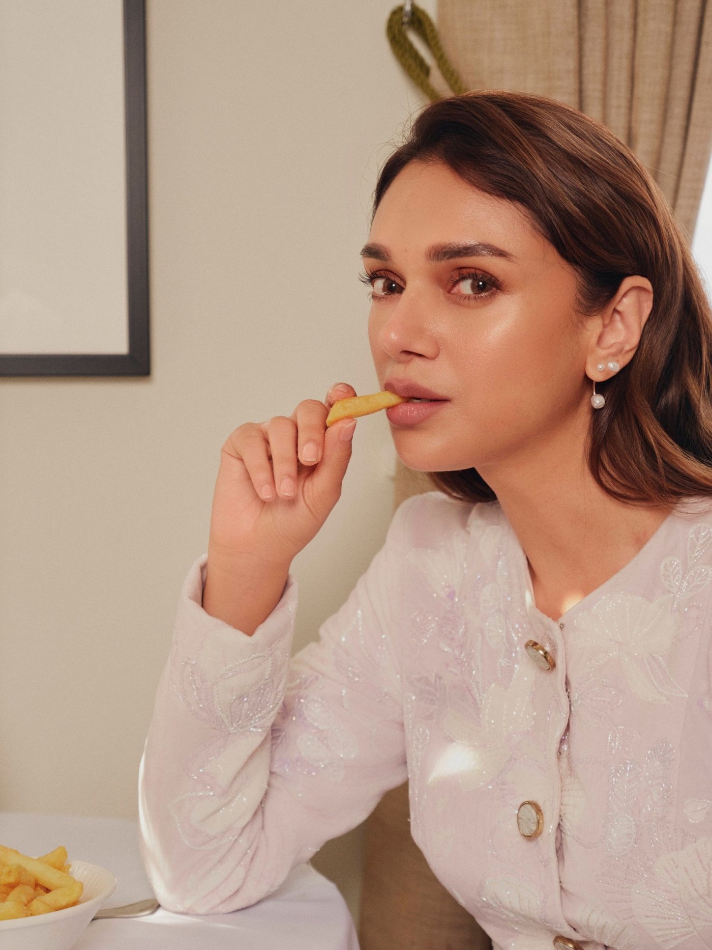 Aditi Rao Hydari showcases an elegant ensemble in pure white tones, radiating timeless grace and charm.