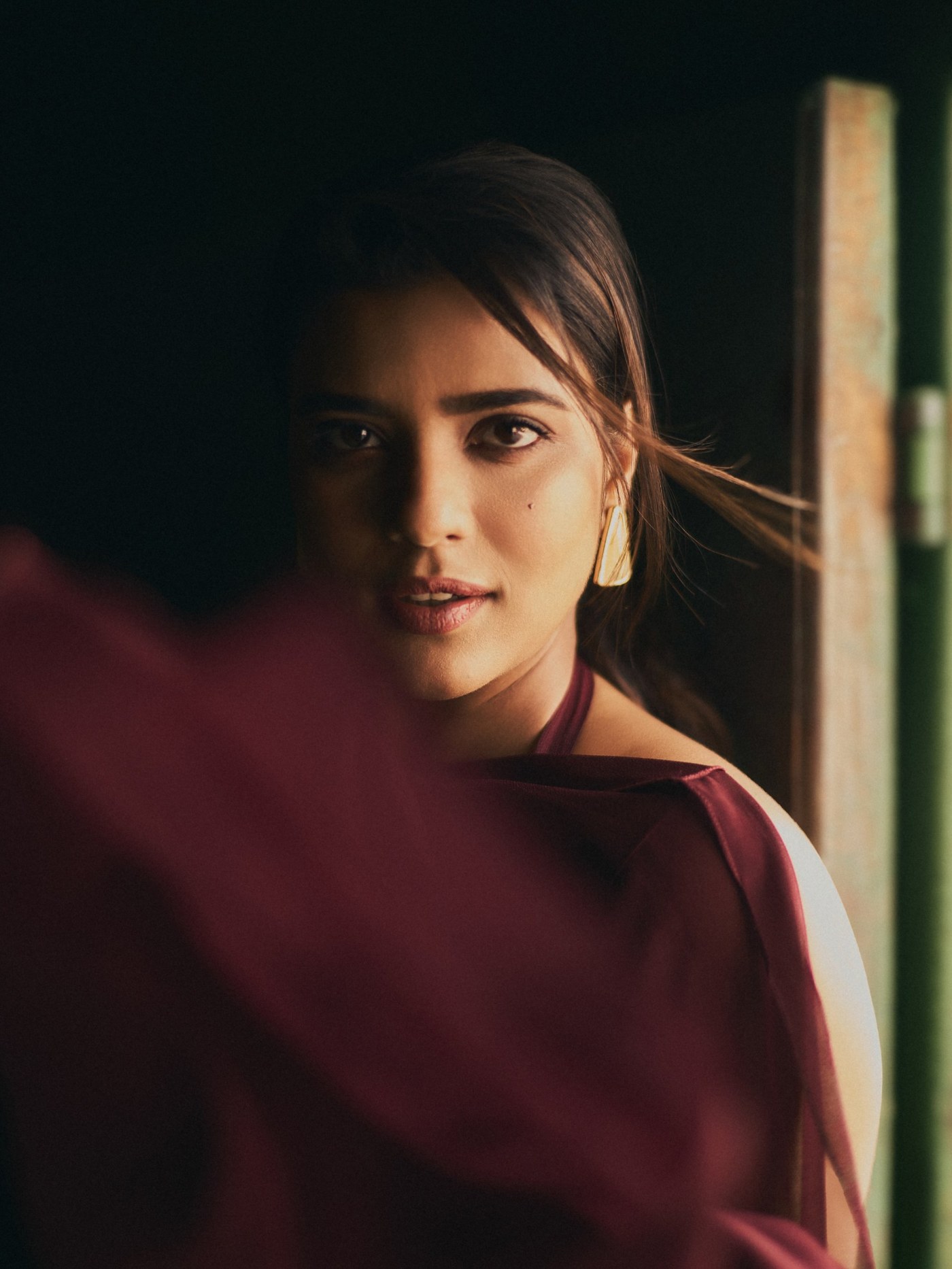 Aishwarya Rajesh radiates effortless grace in a richly colored burgundy ensemble at her recent appearance.