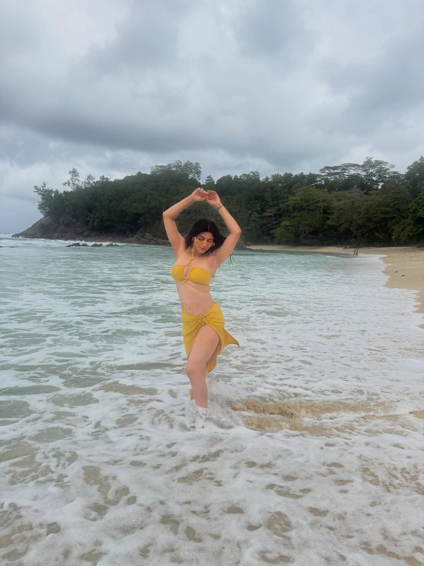 Akanksha Puri enjoys a beachside moment with ocean sounds. - Photos & Updates