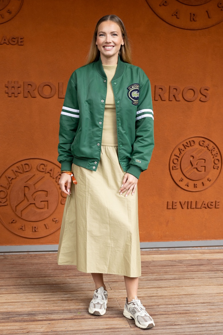 Amandine Petit posing gracefully in a stylish outfit at an event.