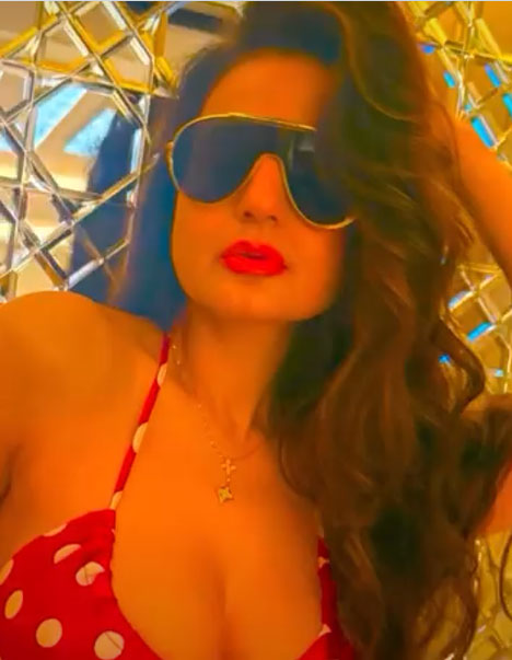 Patel's Dubai Polka Dot Look Against Cityscape