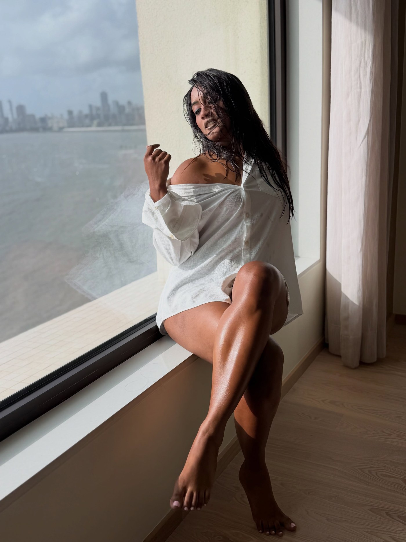 Amika Shail Masters Effortless Chic in Oversized White Shirt