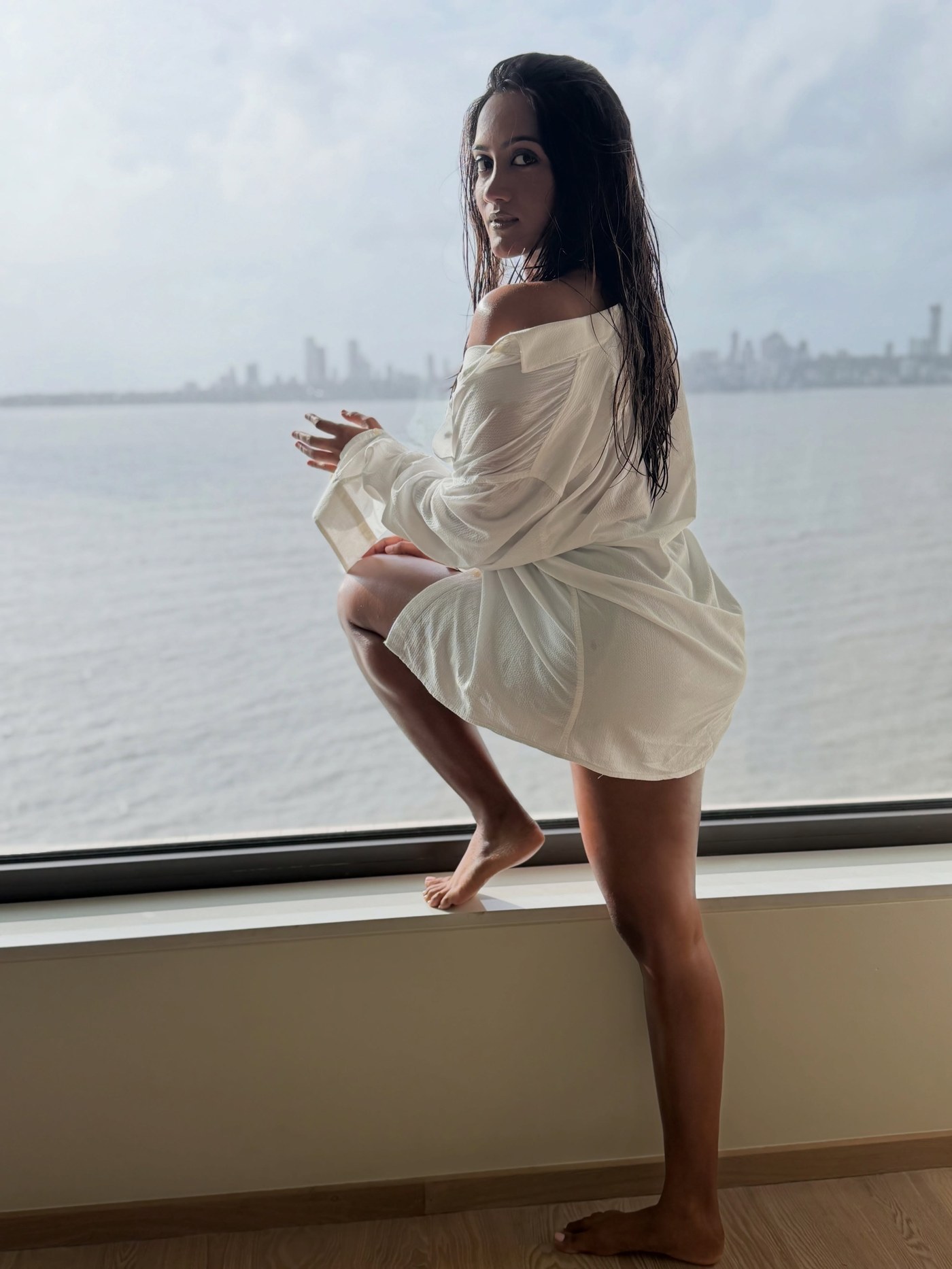 Amika Shail Masters Effortless Chic in Oversized White Shirt
