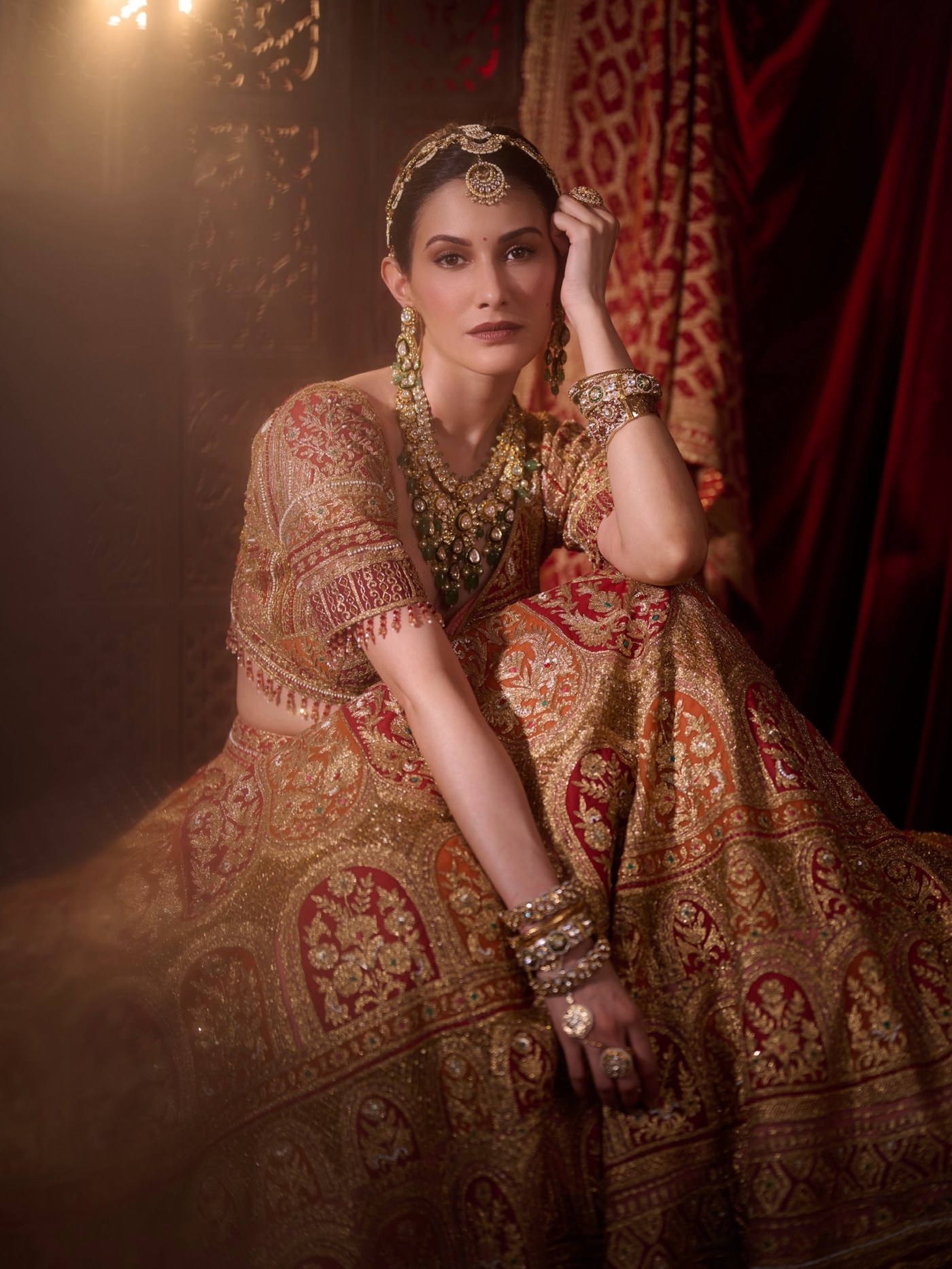 Amyra Dastur shines in a magnificent regal lehenga featuring rich golden accents and exquisite traditional embroidery.