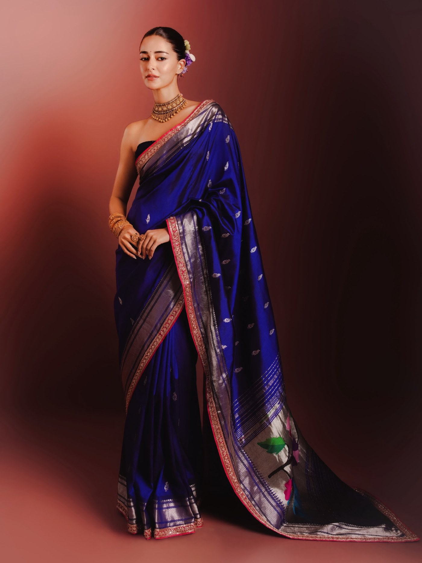 Ananya Panday elegantly showcases a traditional handwoven silk Paithani saree designed by Manish Malhotra.