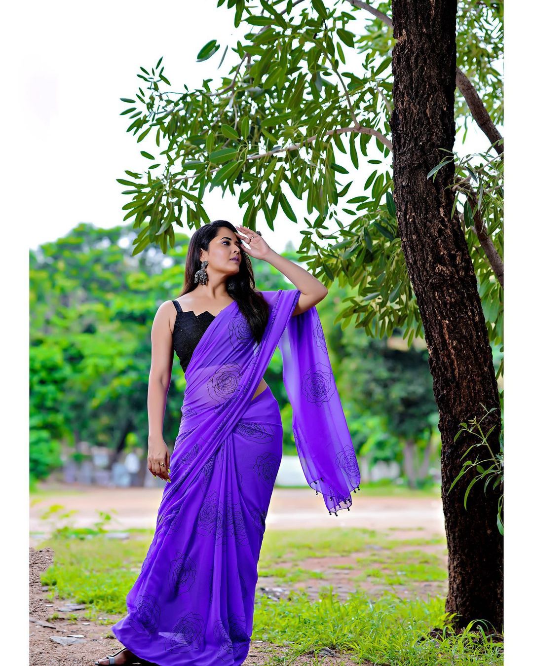 Anasuya Bharadwaj in Stunning Purple Attire