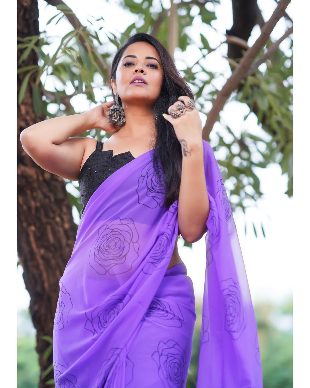 Anasuya Bharadwaj in Stunning Purple Attire