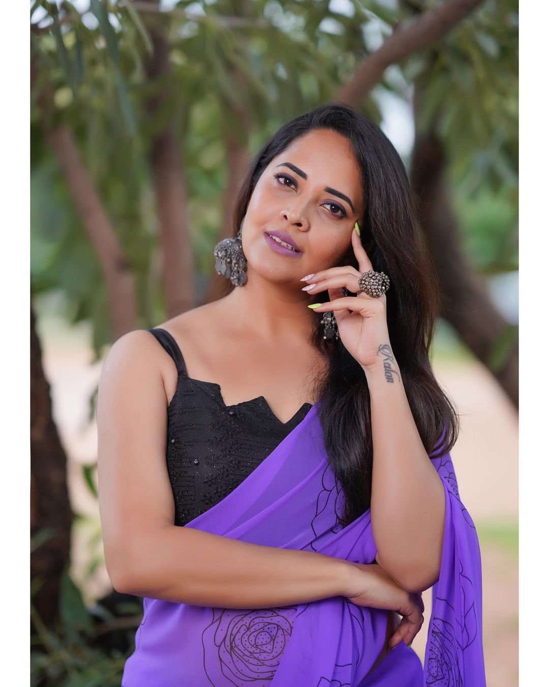 Anasuya Bharadwaj in Stunning Purple Attire