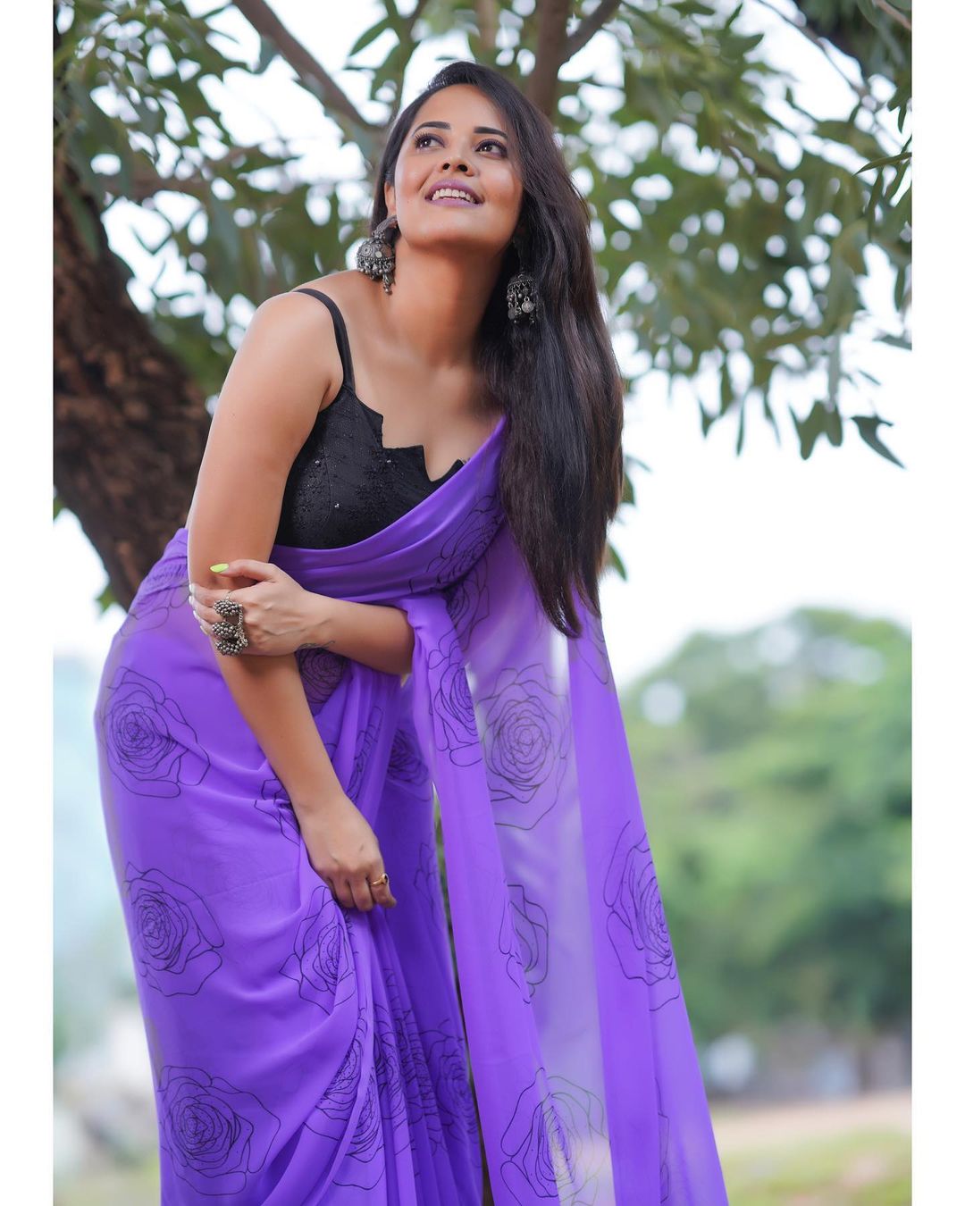 Anasuya Bharadwaj in Stunning Purple Attire