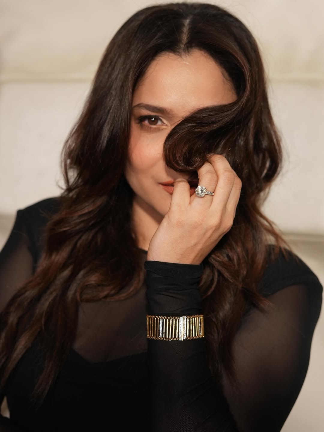 Ankita Lokhande is featured in a vibrant, colorful setting.