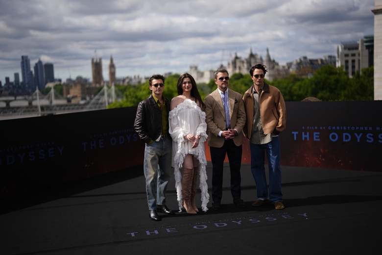 Anne Hathaway attends a glamorous photocall, showcasing stunning poise and sophisticated fashion choices.