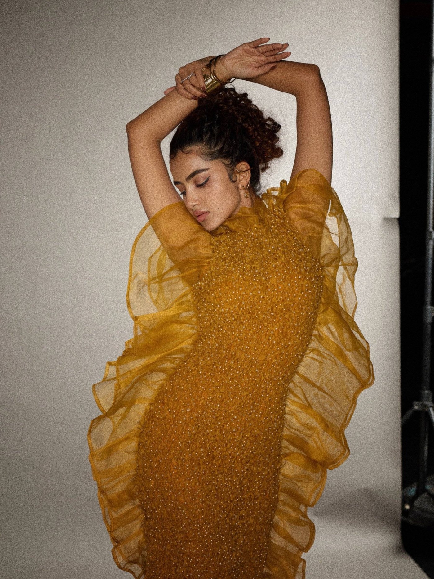 Mustard Gold Gown: Anupama Parameswaran's Dramatic Silhouette