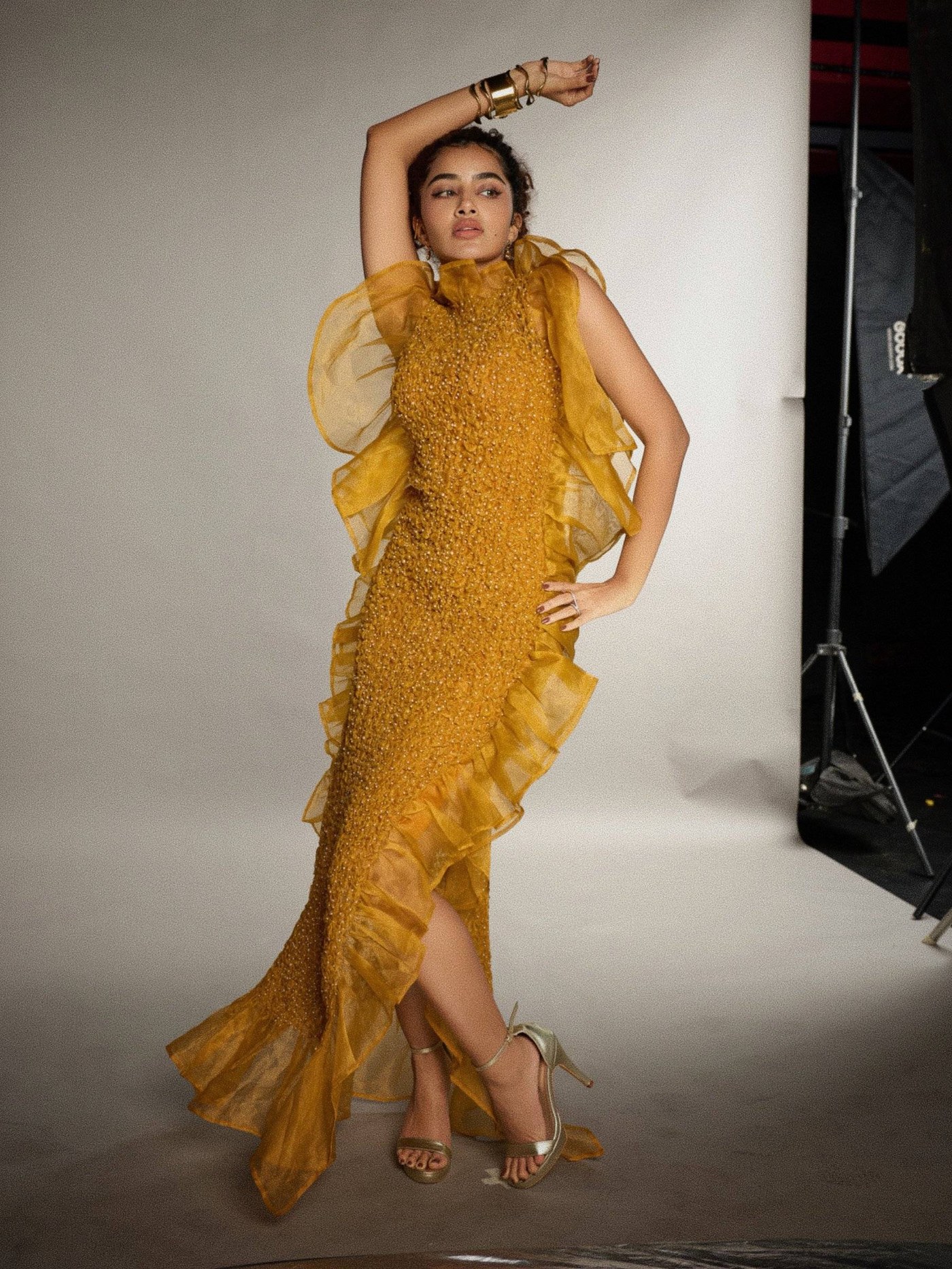 Mustard Gold Gown: Anupama Parameswaran's Dramatic Silhouette