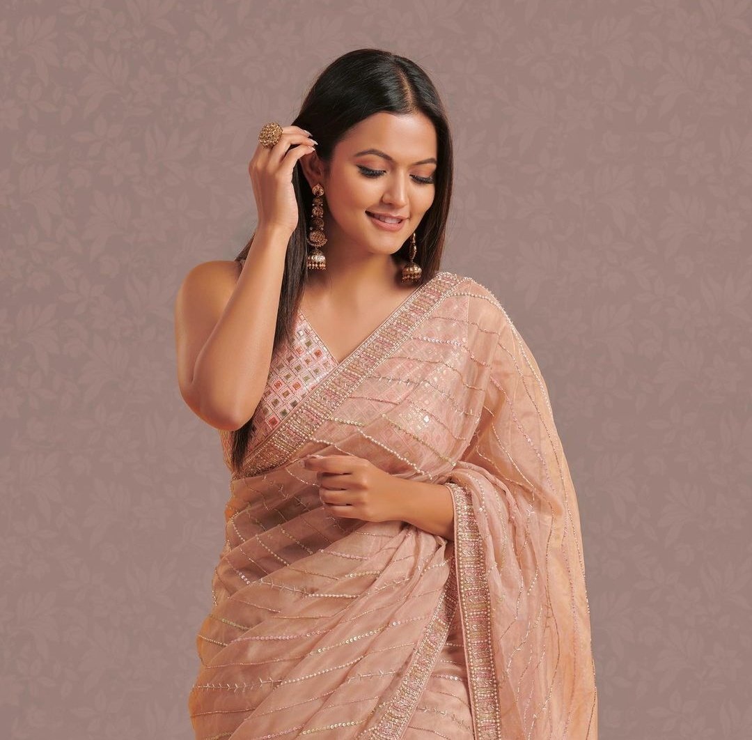 Aparna Das: Ethereal Elegance in Golden Hues