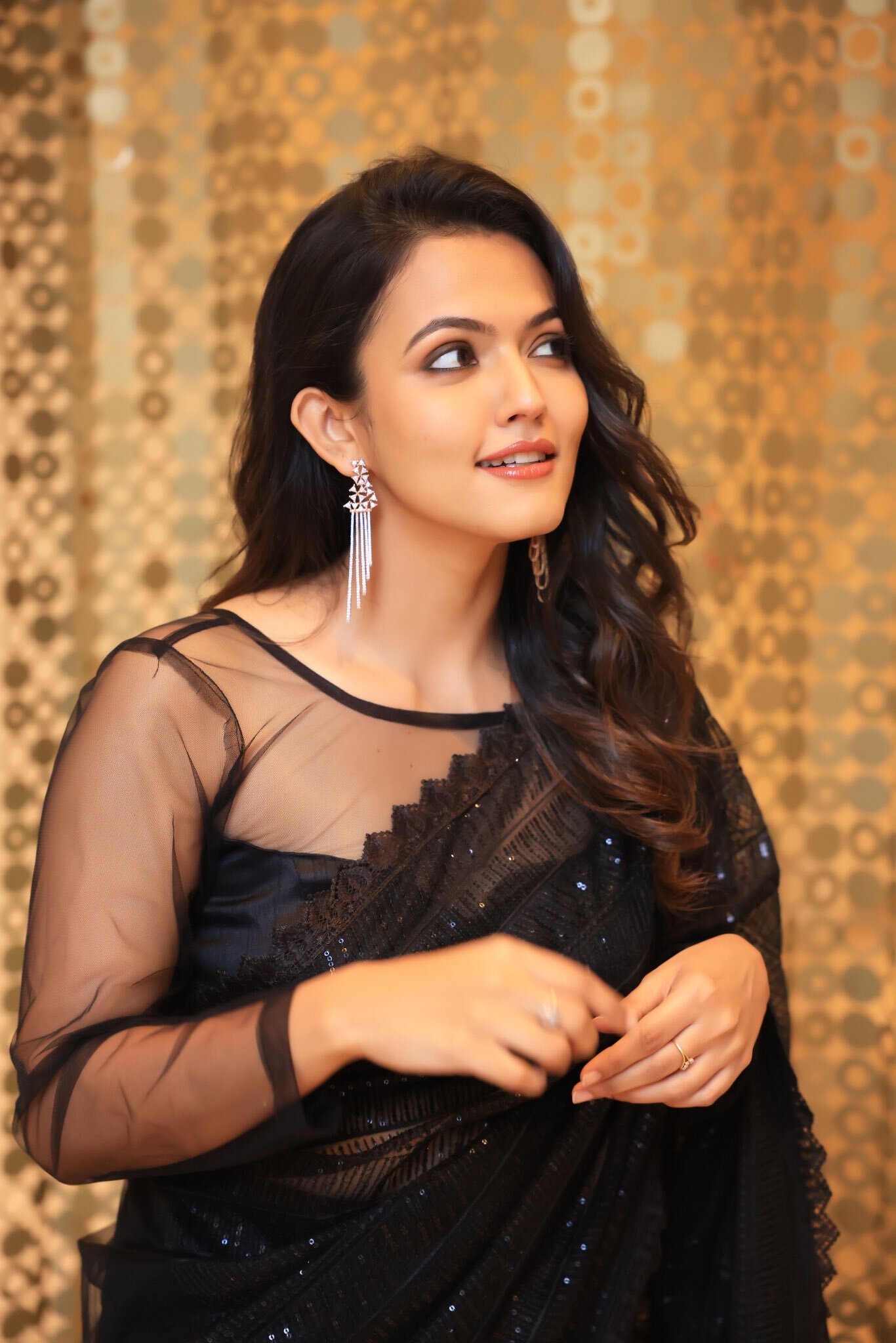 Aparna Das: Ethereal Elegance in Golden Hues
