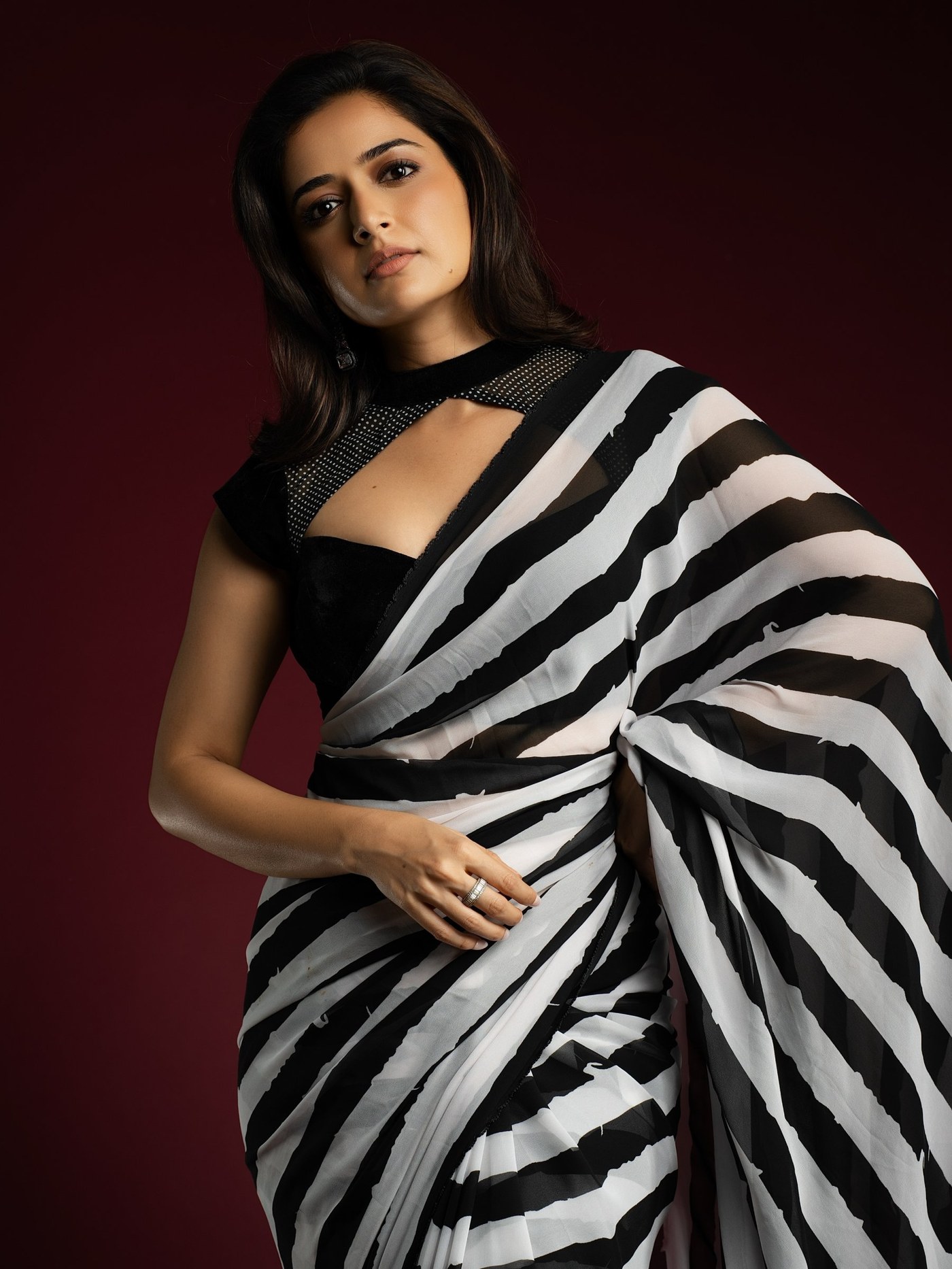 Ashika Ranganath is seen showcasing a sophisticated monochrome look featuring contemporary draping and statement jewelry. - Photos & Updates