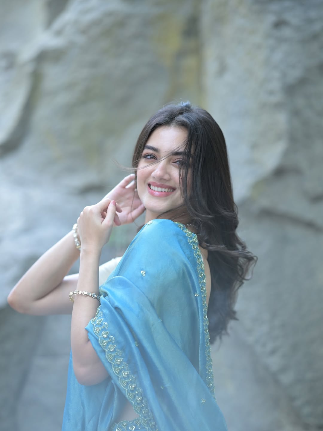 Bhagyashri Borse smiles warmly while attending an event.