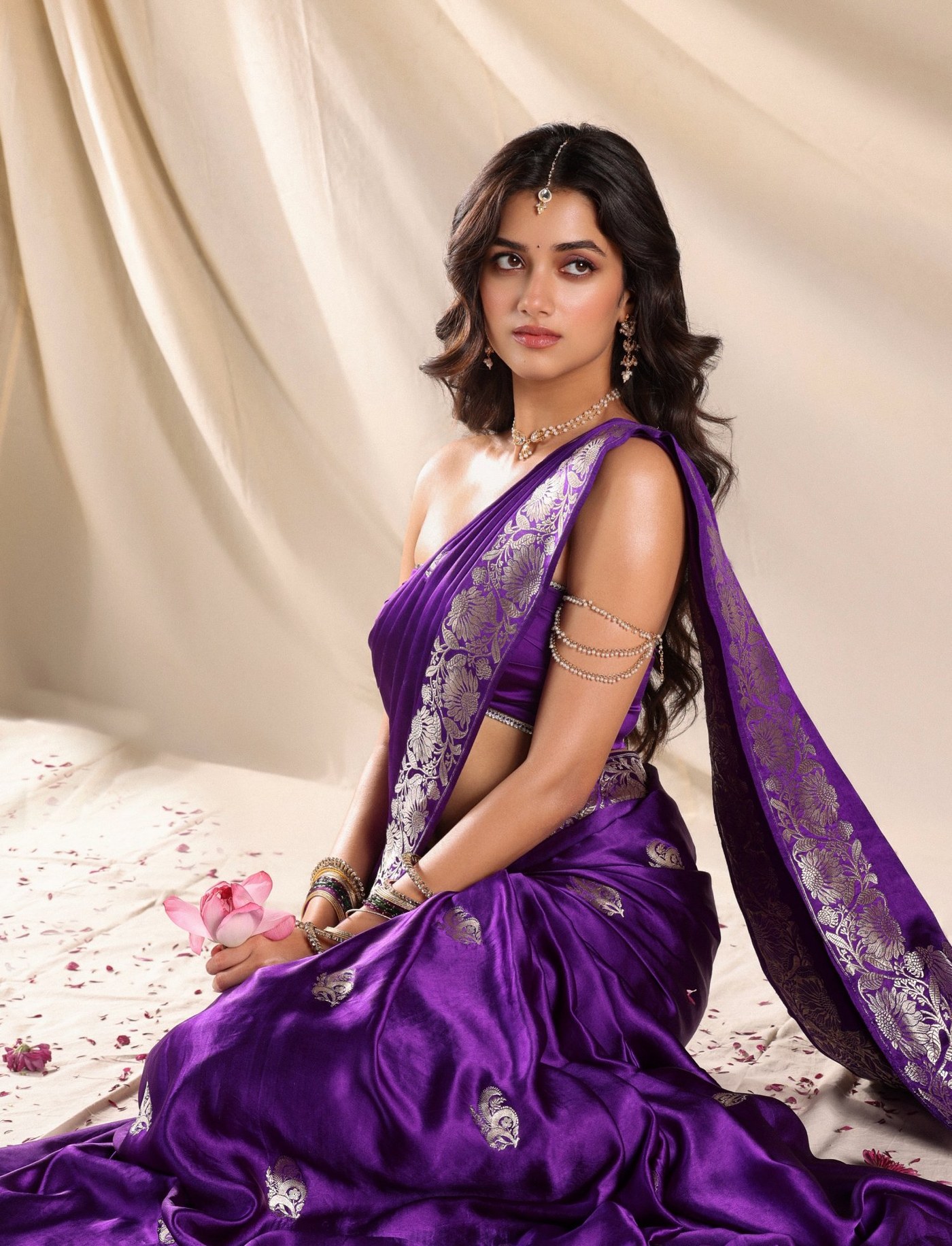 Bhagyashri Borse shines radiant in a luxurious royal deep purple saree adorned with intricate golden embroidery.