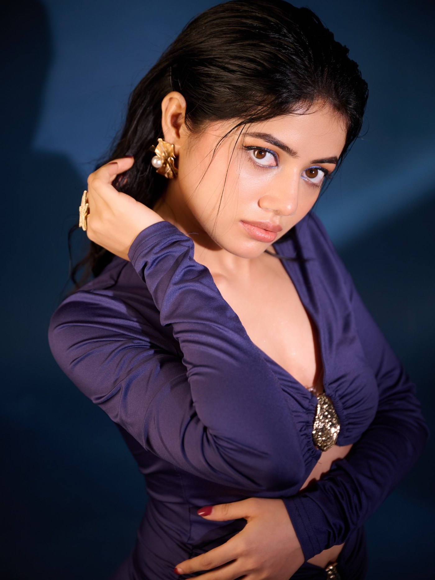 Bhairavi Ardhya Deka showcases a striking deep blue, couture-inspired outfit with elegant detailing.