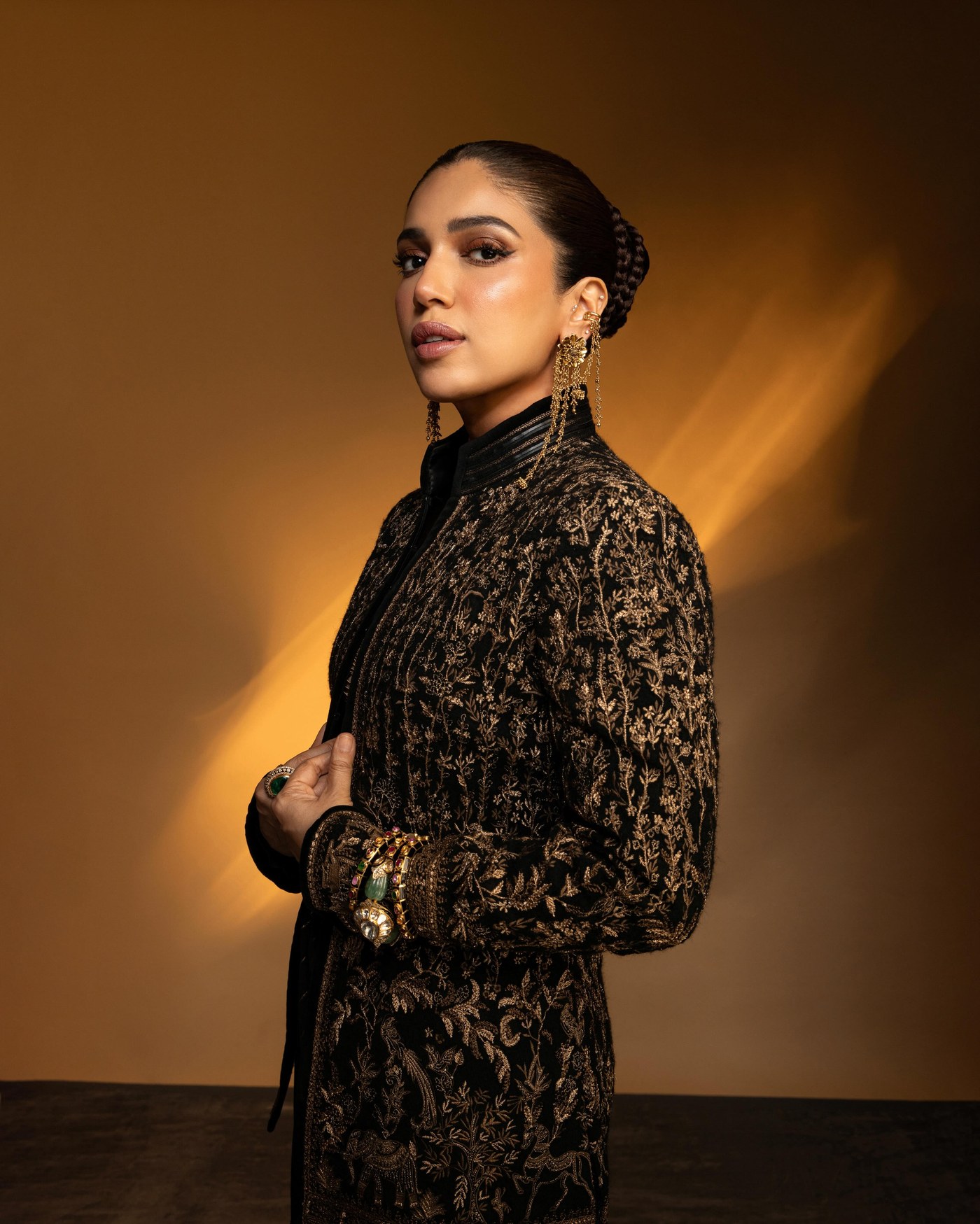 Bhumi Pednekar showcases a stunning fusion of royal elegance with her striking black and gold ensemble.