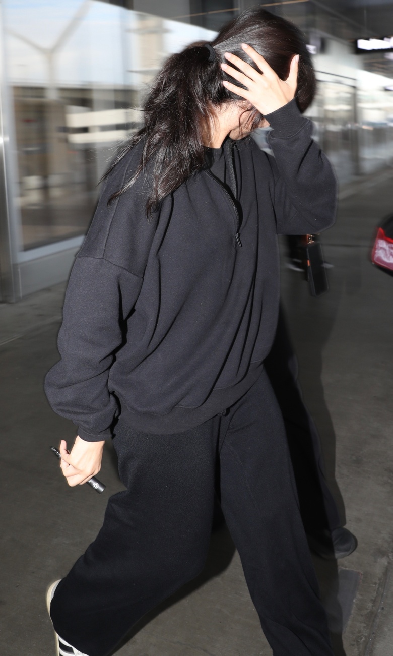 Camila Cabello is seen arriving or posing gracefully at a high-profile celebrity event or airport location.