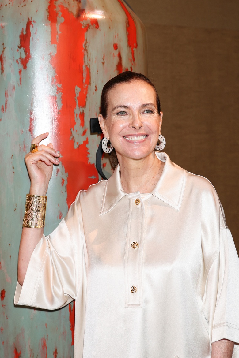 Carole Bouquet graces the scene at the Chanel Haute Couture show during Paris Fashion Week.