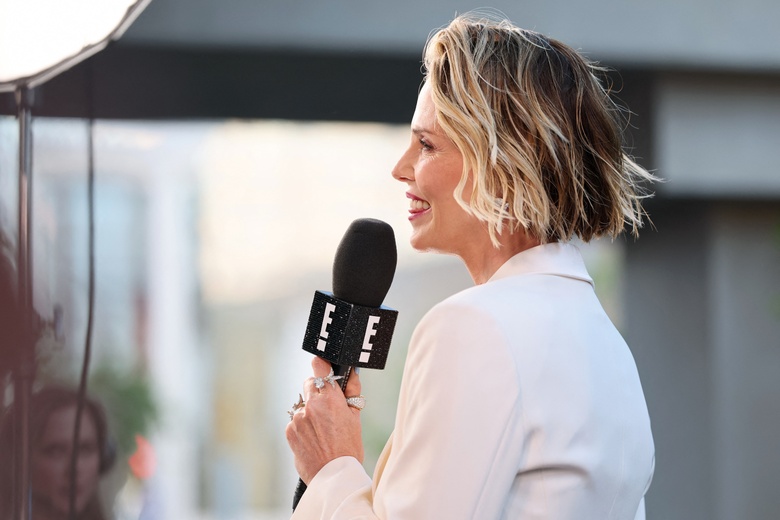 Charlize Theron is captured looking stunning on a premiere red carpet, radiating star power and timeless beauty.
