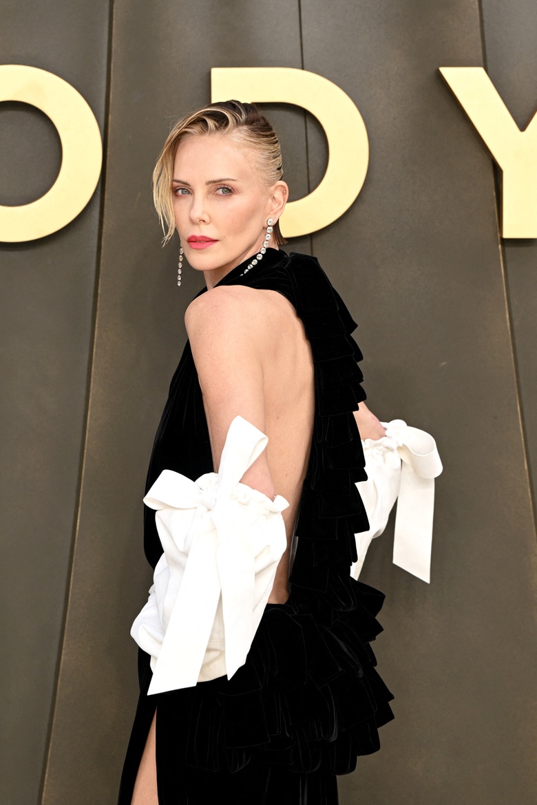Charlize Theron Owns the Red Carpet at 'The Odyssey' World Premiere