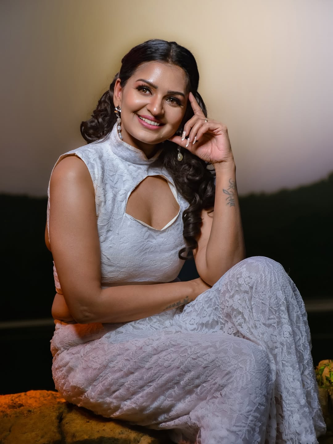 Anandhi Ajay is seen posing in a stunning outfit and accessories for a professional photoshoot.