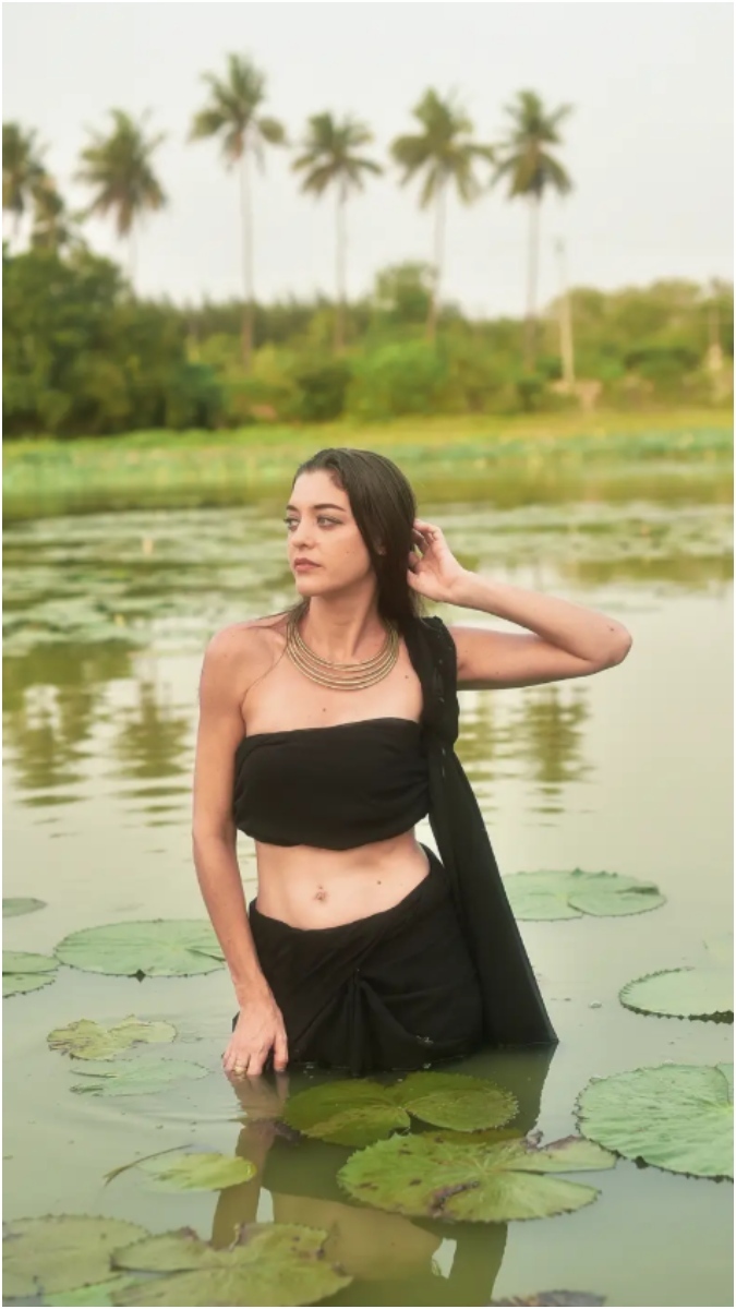Cooku With Comali Andreanne in a diptych pose within a natural, watery setting with flowing wet hair and a delicate necklace.