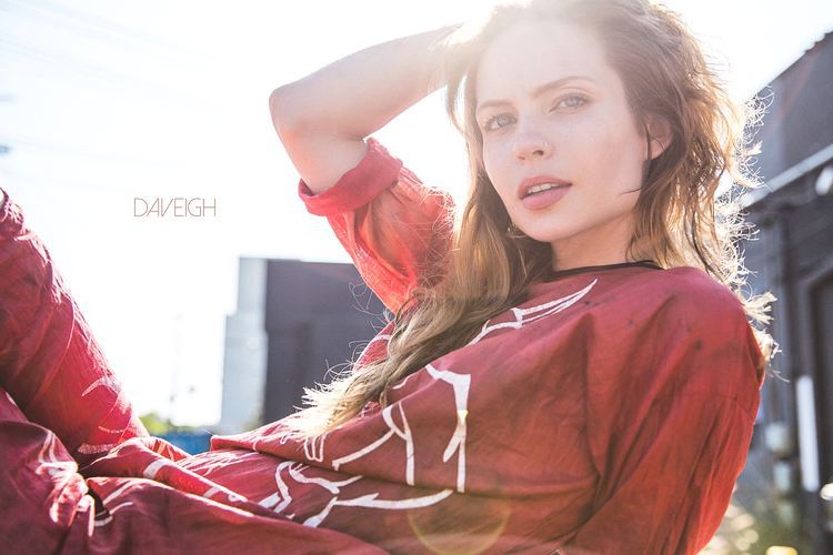 Daveigh Chase posing for a photo during an outdoor gathering.