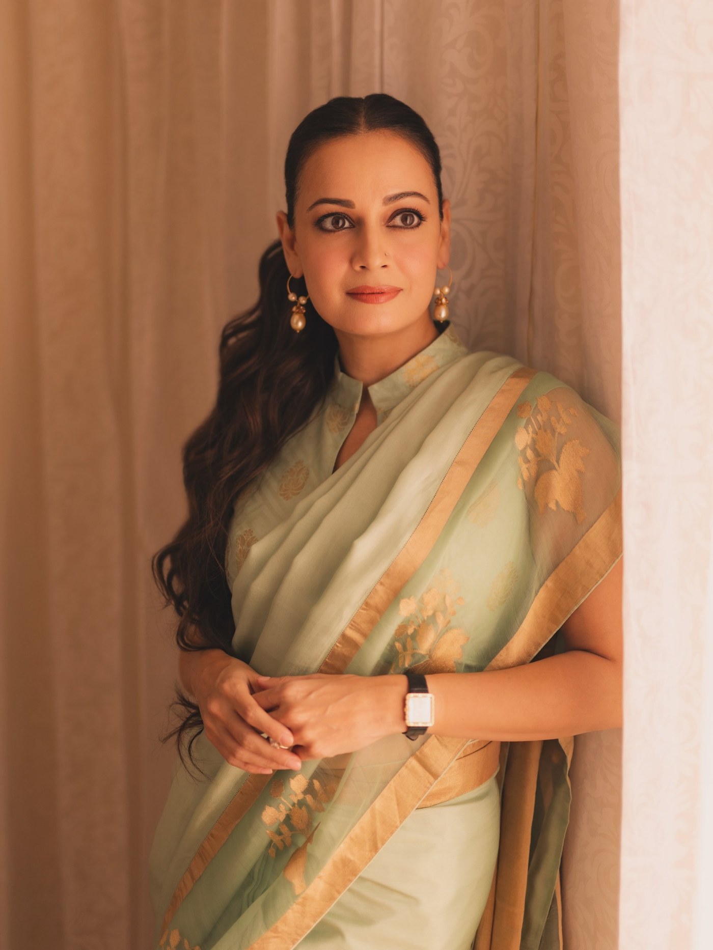 Dia Mirza wears a muted green Raw Mango saree, embodying graceful sophistication at a special TV event.