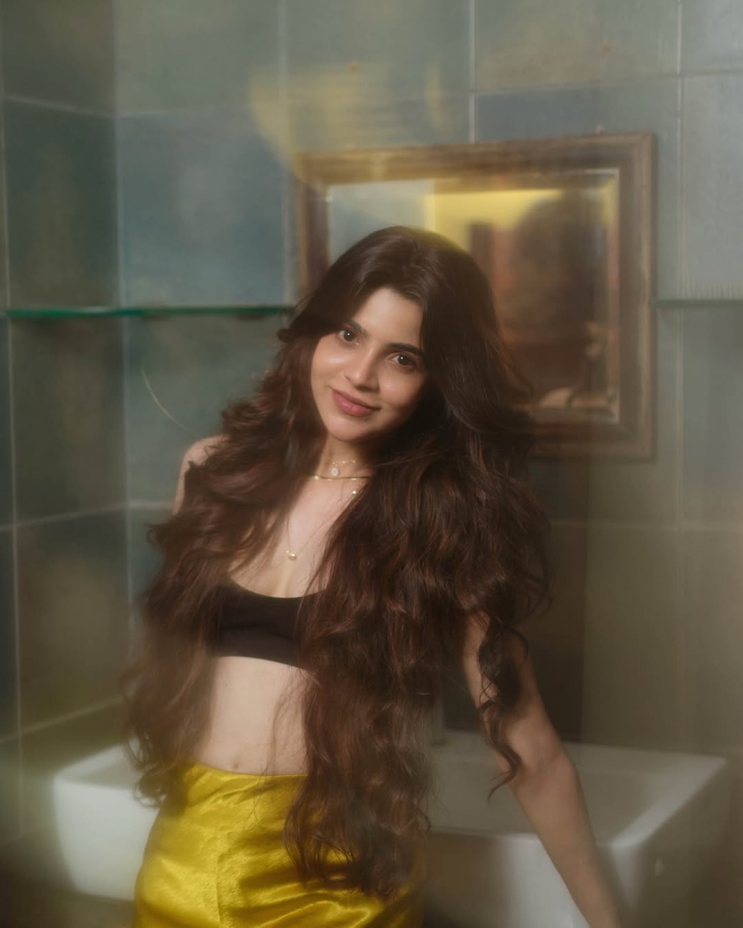 Divya Bharathi’s Latest Photoshoot: Glowing in Gold and Black!