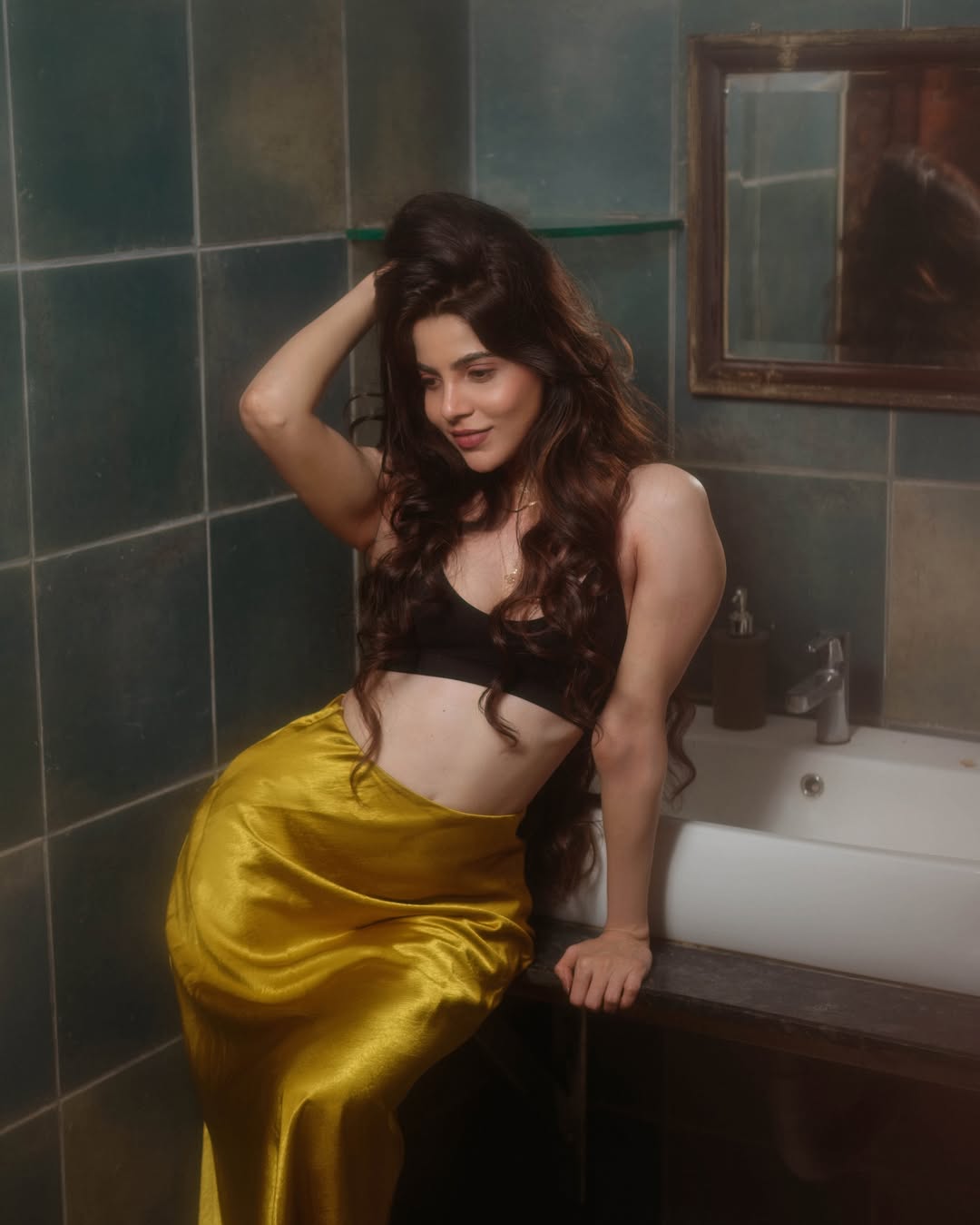 Divya Bharathi’s Latest Photoshoot: Glowing in Gold and Black!