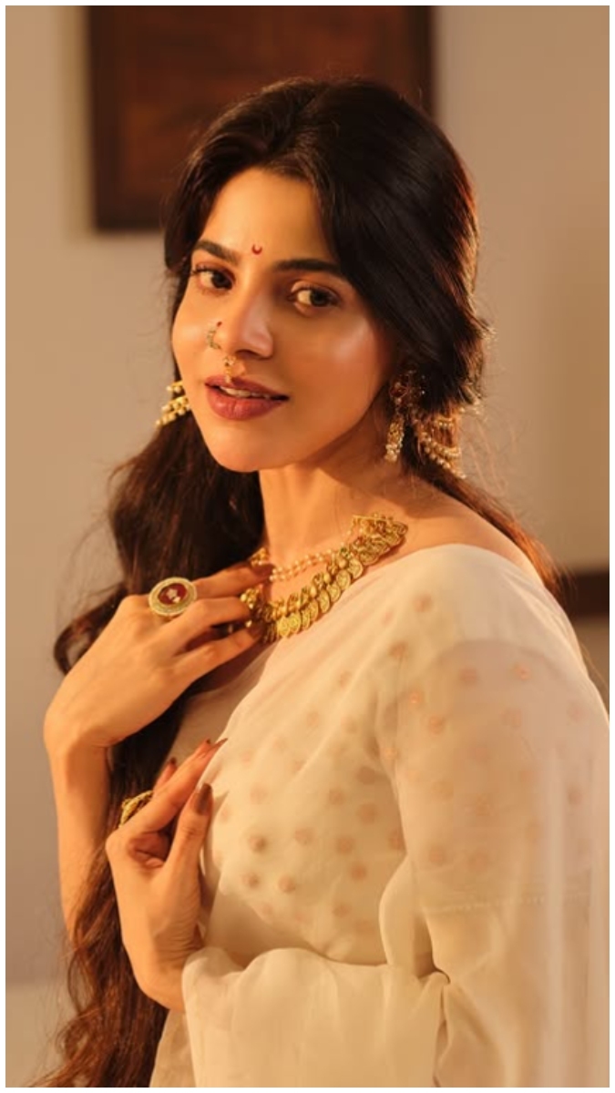 Divyabharathi in a split photograph featuring two different poses and settings, adorned with gold jewelry and draped in sheer fabric.