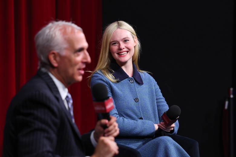 Elle Fanning posing elegantly at a special event.