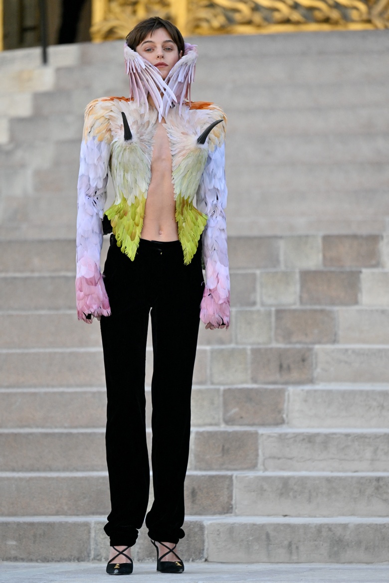 Emma Corrin makes a stylish entrance during the Schiaparelli Show at Paris Haute Couture Fashion Week.