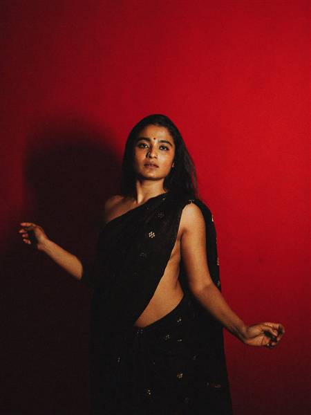 Chaithra Achar posing gracefully during the event.
