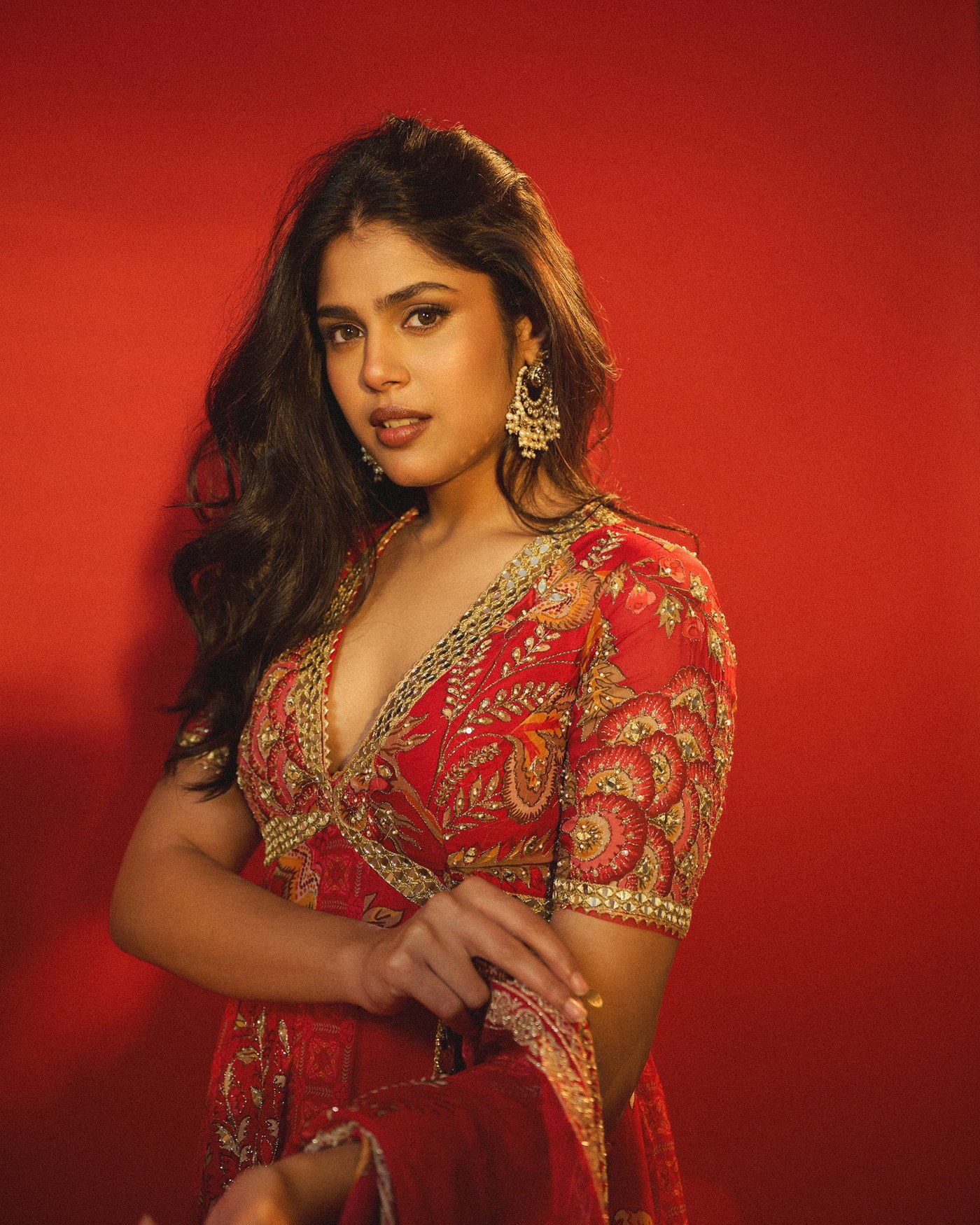 Faria Abdullah poses in a deep red embroidered outfit