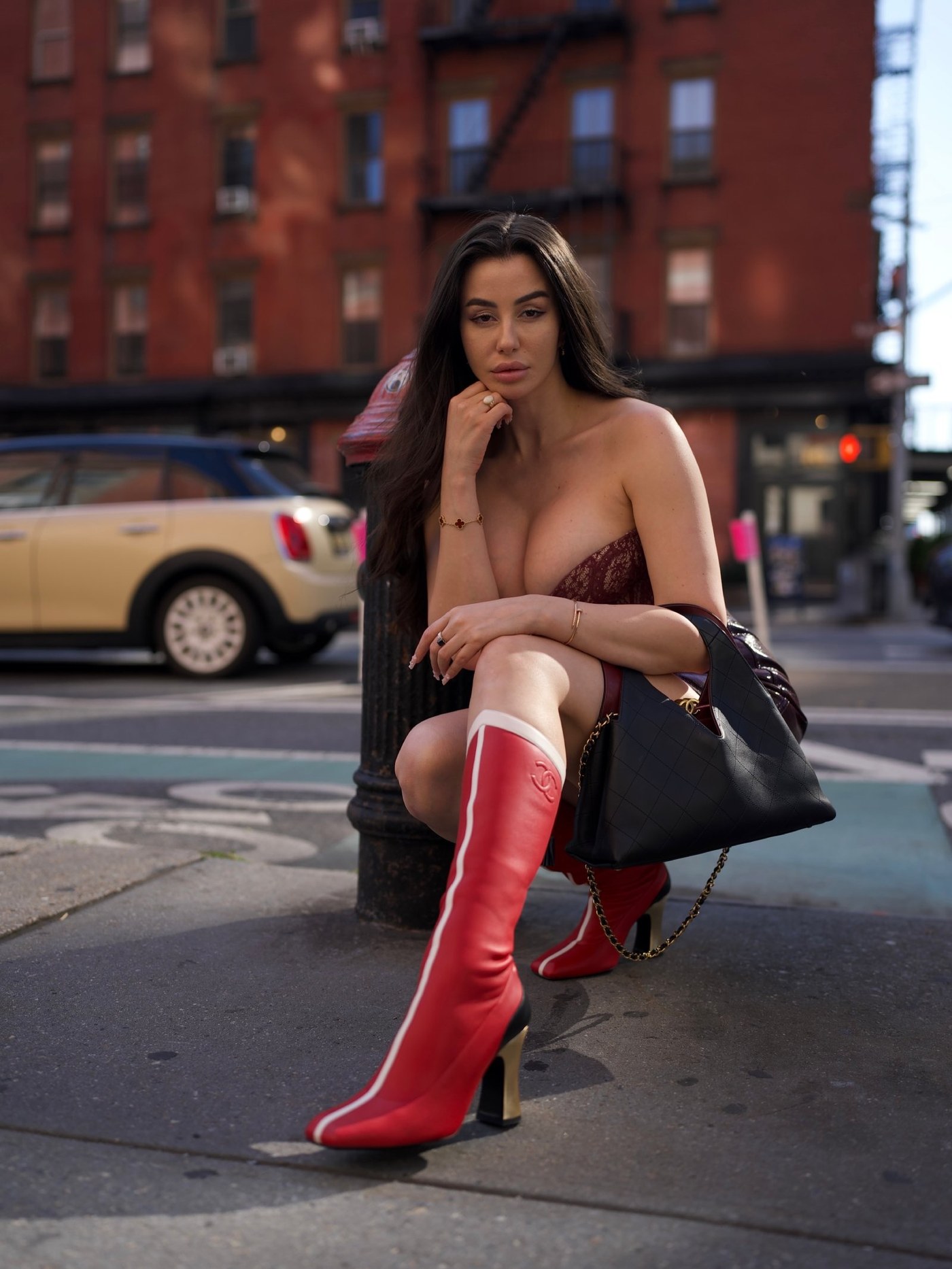 Giorgia Andriani Turns Heads with Bold Burgundy and Red Boots