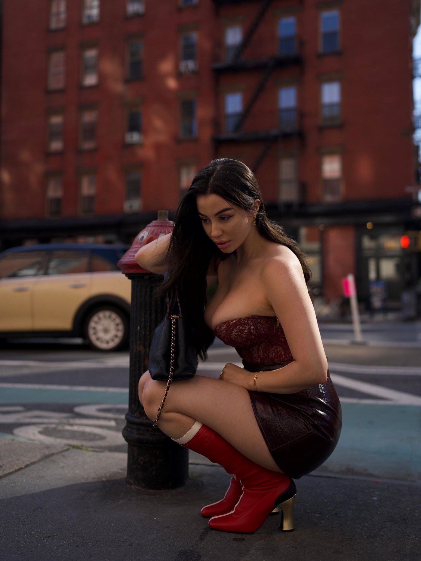 Giorgia Andriani Turns Heads with Bold Burgundy and Red Boots