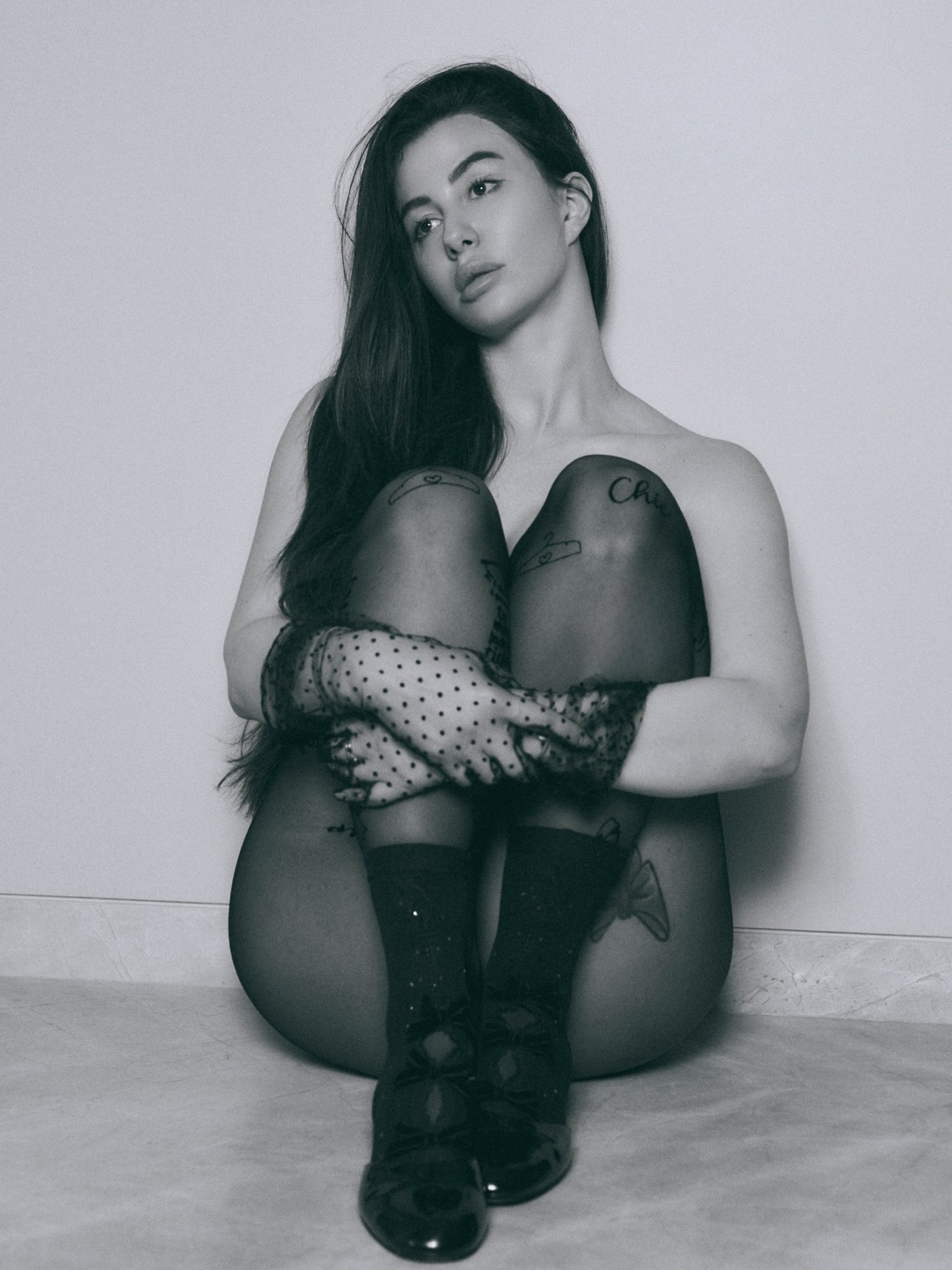 Giorgia Andriani models a high-concept editorial look in monochrome with vintage-inspired accessories.