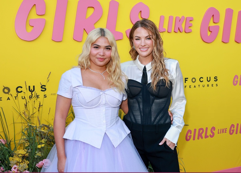 Hayley Kiyoko posing in a bright, casual setting with stylish attire.
