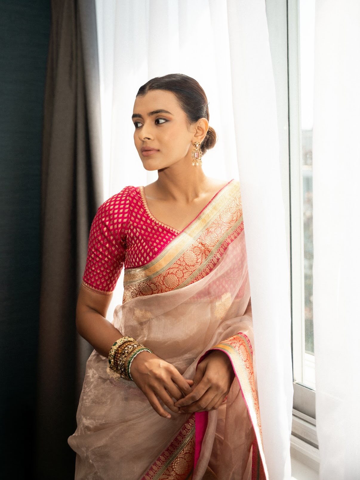 Hebah Patel radiates timeless charm draped in a beautifully woven silk saree at a special event.