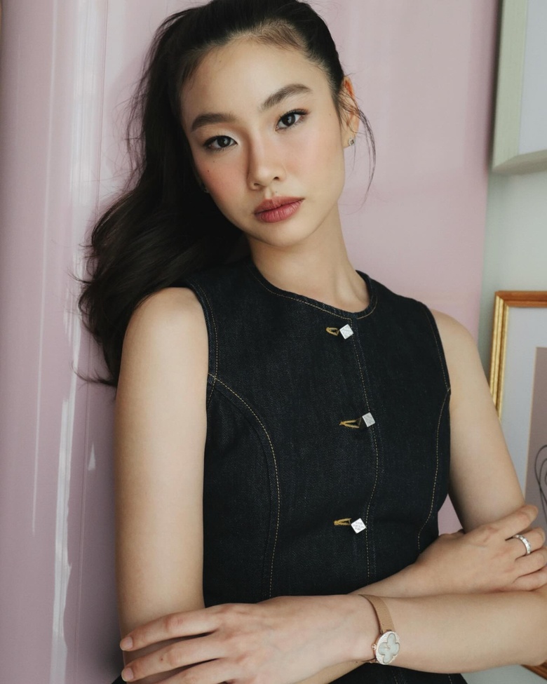 Hoyeon Jung attends a formal press tour, showcasing elegant styling and poised confidence.