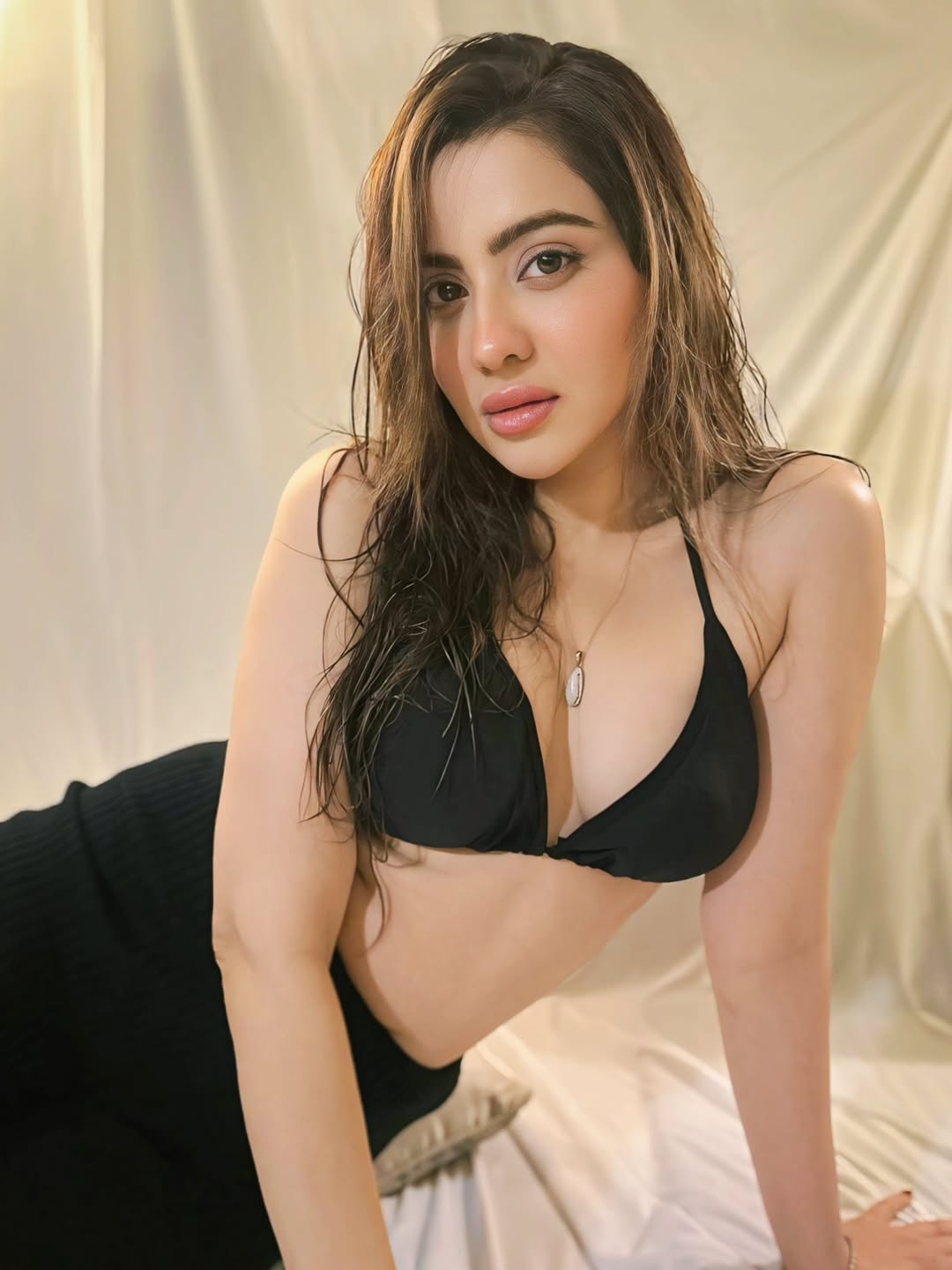 Hritiqa Chheber posing elegantly in a brightly lit setting.