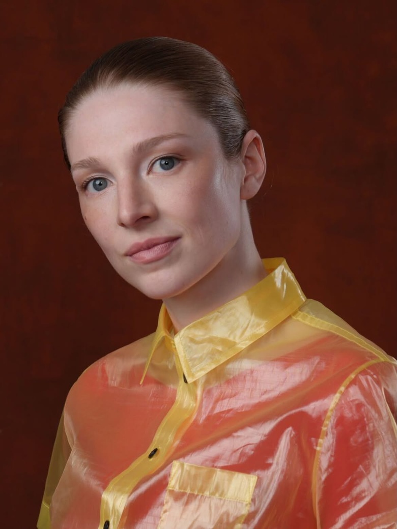 Hunter Schafer attends a major event, radiating confidence in a chic ensemble and stunning pose.