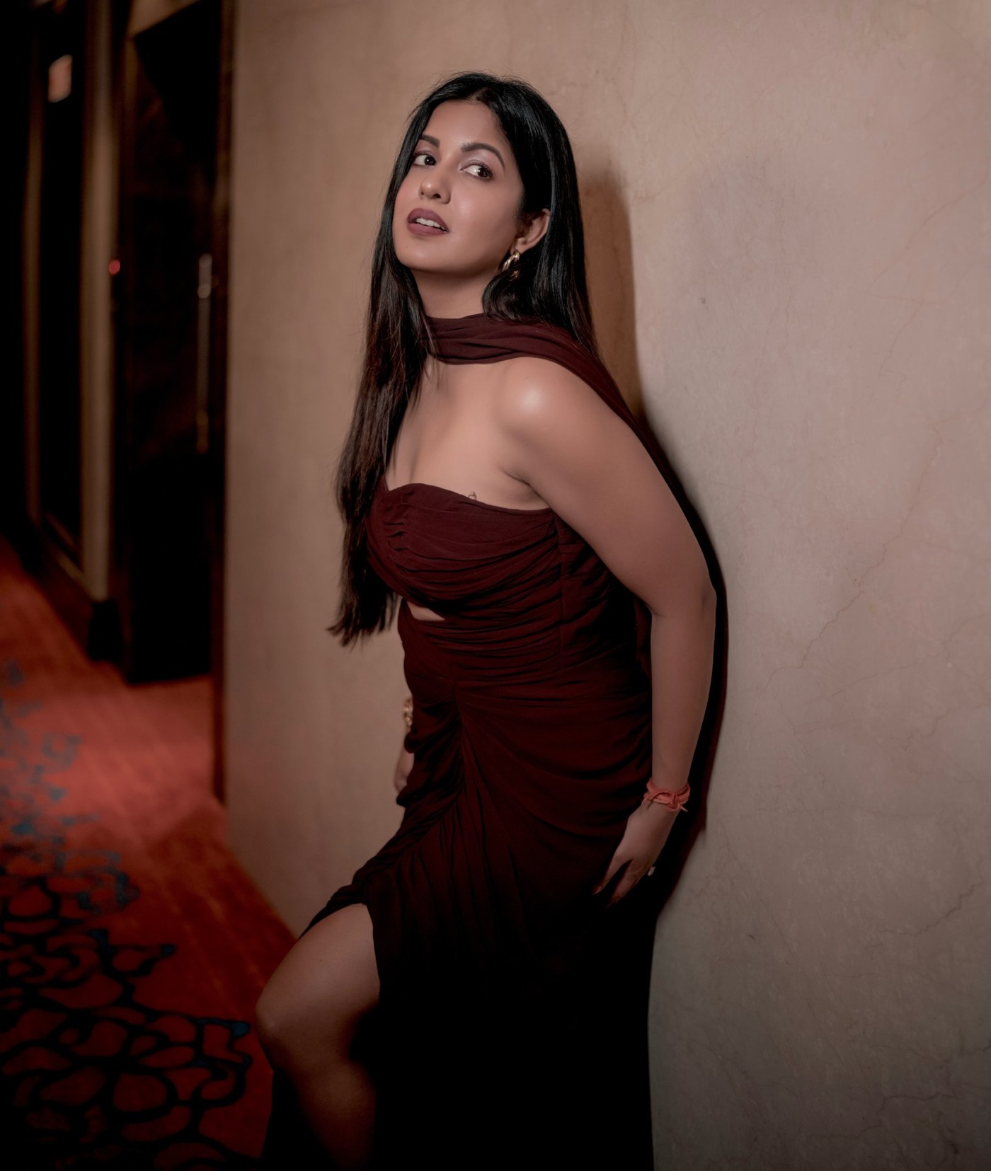 Ishita Dutta shines in an elegant, rich maroon evening gown with contemporary styling.